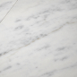 Preview: Nahaufnahme von Bianco Carrara Marmor mit natürlicher grauer Aderung