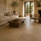 Preview: Travertin Noce Fliesen im Wohnzimmer im Format 61 x 40,6 cm mit warmer Natursteinoptik